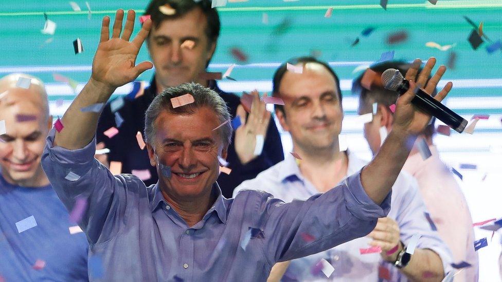 Argentine President Mauricio Macri greets supporters at the Cambiemos headquarters, in Buenos Aires