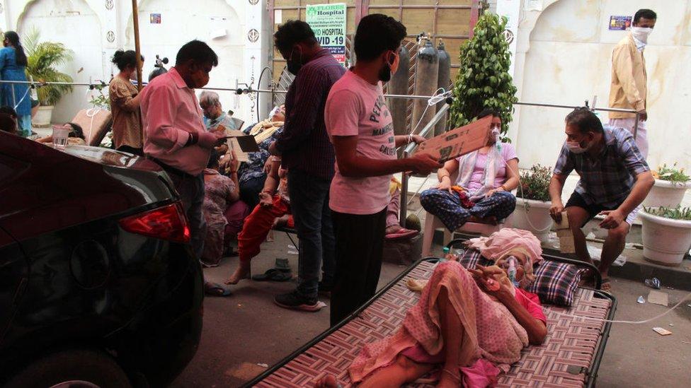 A woman receives free oxygen support outside a Gurudwara (Sikh temple) in Ghaziabad, India