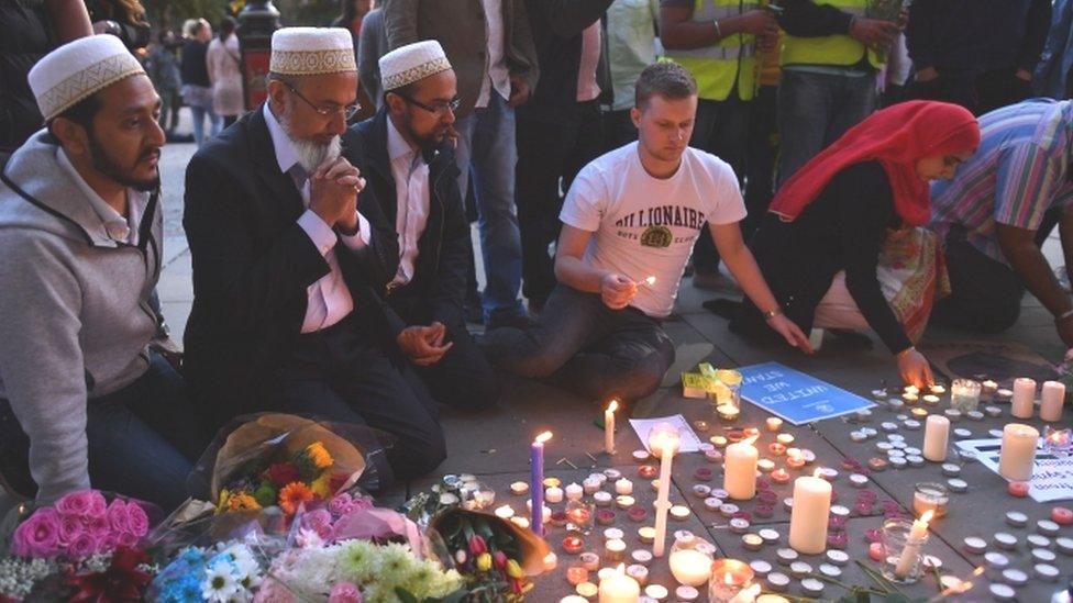 Mourners at the makeshift memorial in Manchester's Albert Square, following the attack there