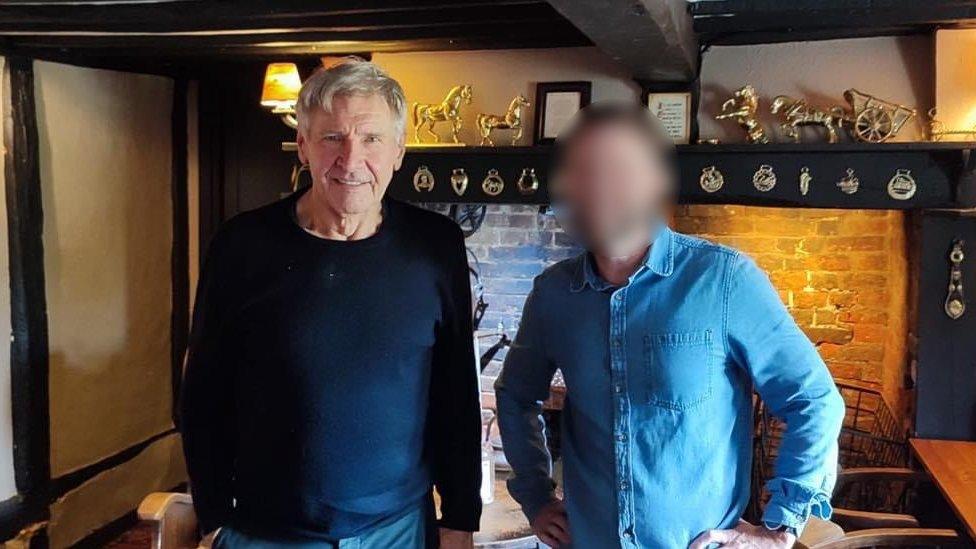 Harrison Ford with a fan