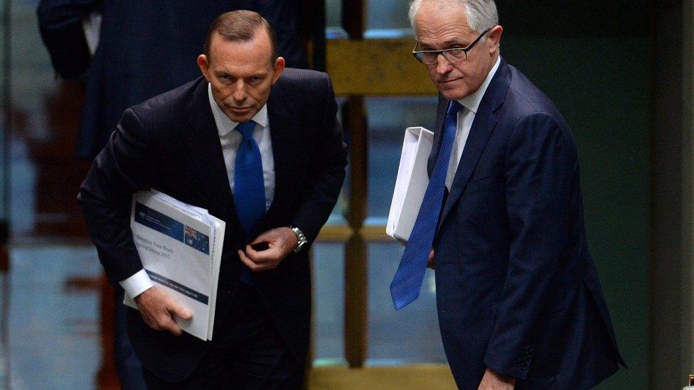 Australian Prime Minister Tony Abbott (L) and Australian Federal Minister for Communications Malcolm Turnbull at the conclusion of Question Time in the House of Representatives at Parliament House in Canberra, Australia, 14 September 2015.