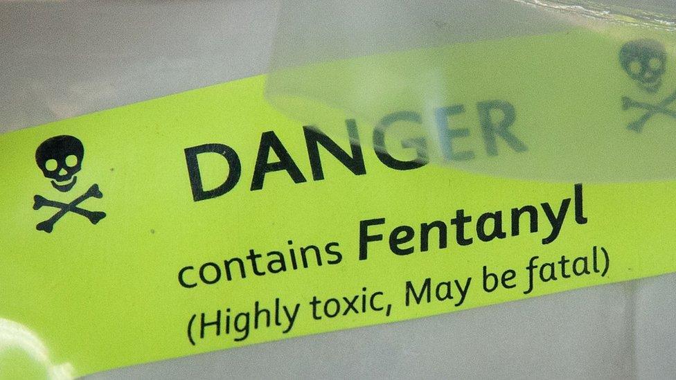 Stock image of a yellow sign saying "Danger - contains Fentanyl.'