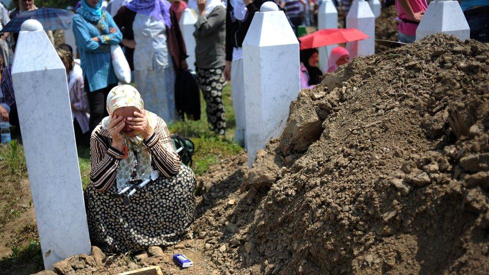 A Bosnian Muslim woman cries on July 11, 2010 during a mass burial for 775 newly identified victims of the 1995 Srebrenica massacre at the Srebrenica Memorial Cemetery in Potocari