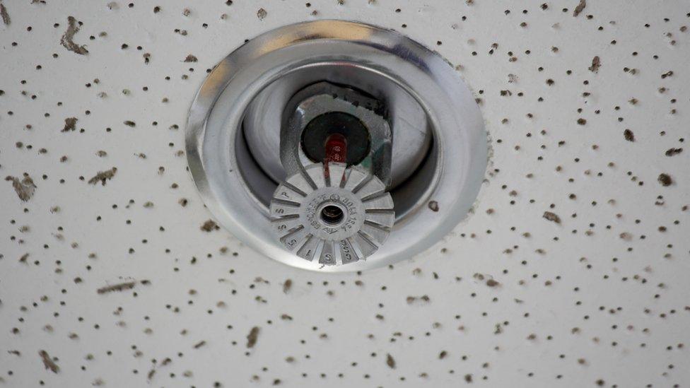 A sprinkler set into a ceiling