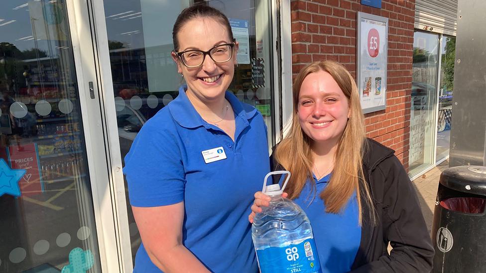 Shop staff with water