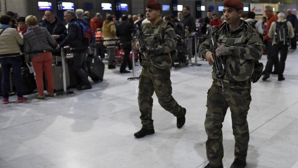 Soldiers patrol at Paris Charles de Gaulle airport as part of security measures set after the Paris attacks