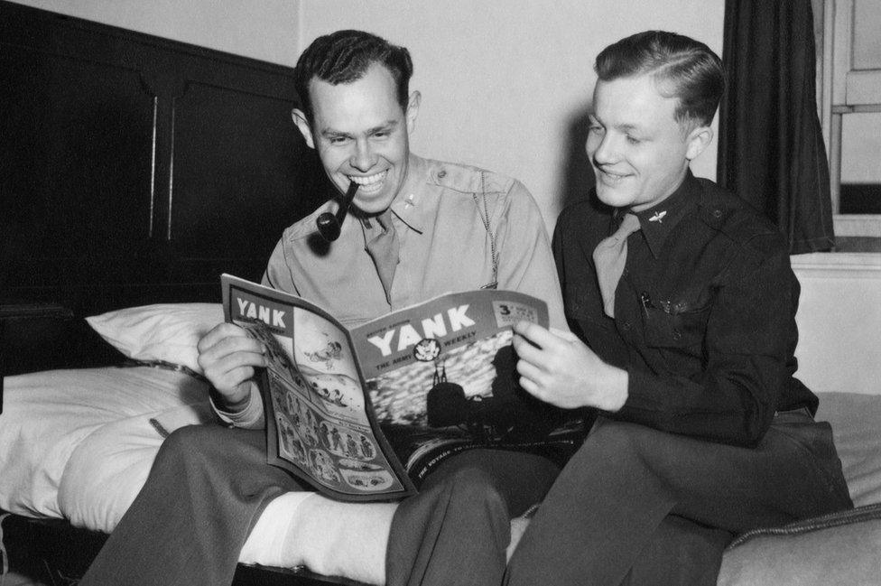 Lt George Hartman (left) and Lt Robert Belliveau read Yank: the Army Weekly at Duxford, August 1943.