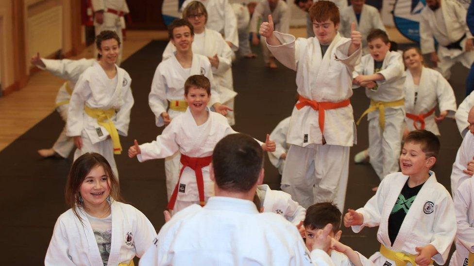 Children taking part in a judo class with the iCan judo group