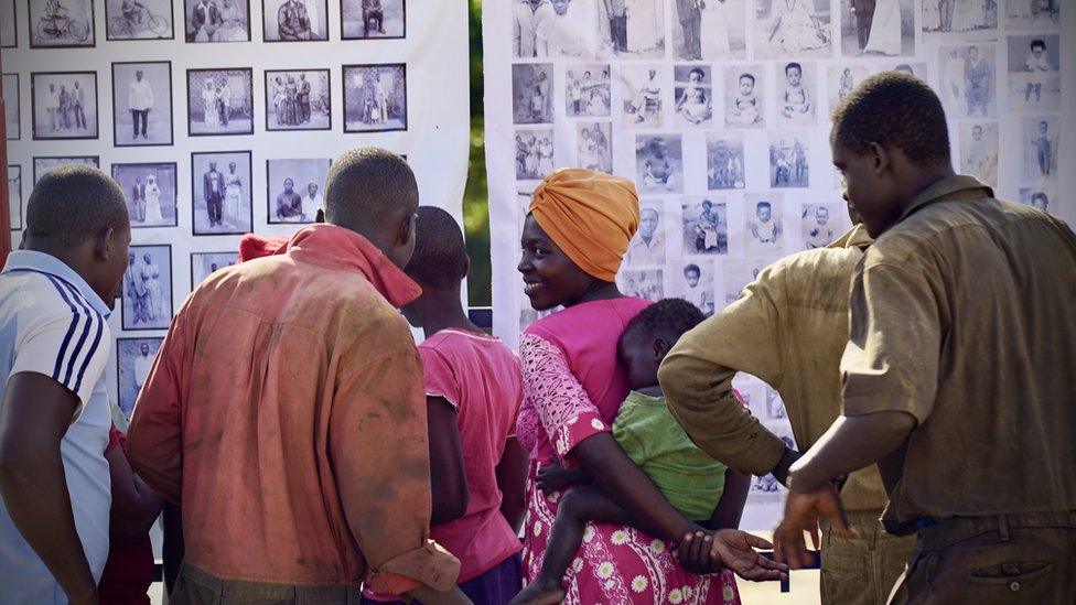 People looking at photographs