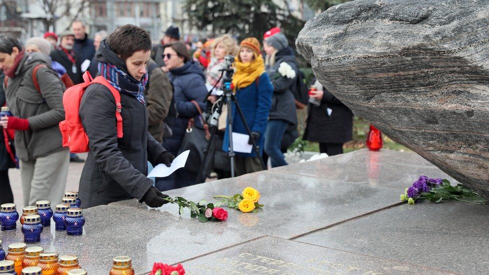 OCTOBER 29, 2019: Young people attend an annual meeting at Solovetsky Stone memorial in Lubyanka Square in central Moscow on the eve of Remembrance Day of Political Repression Victims; during the event known as "Vozvrashcheniye Imyon" (Bringing Back the Names), the participants read out the names of victims of political repression and persecution in the Soviet Union.