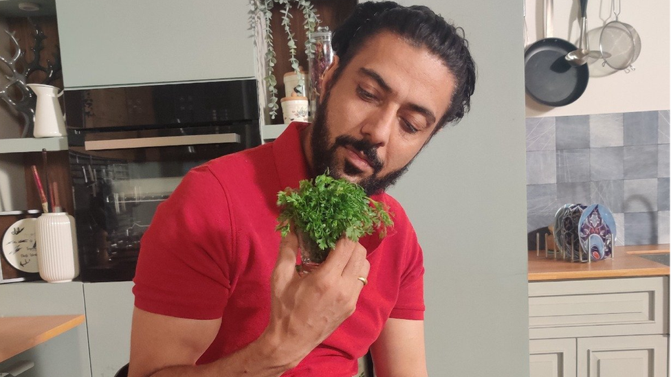 Chef Ranveer Brar with a bunch of coriander