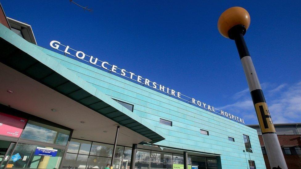 A view of the entrance to Gloucestershire Royal Hospital on a sunny day