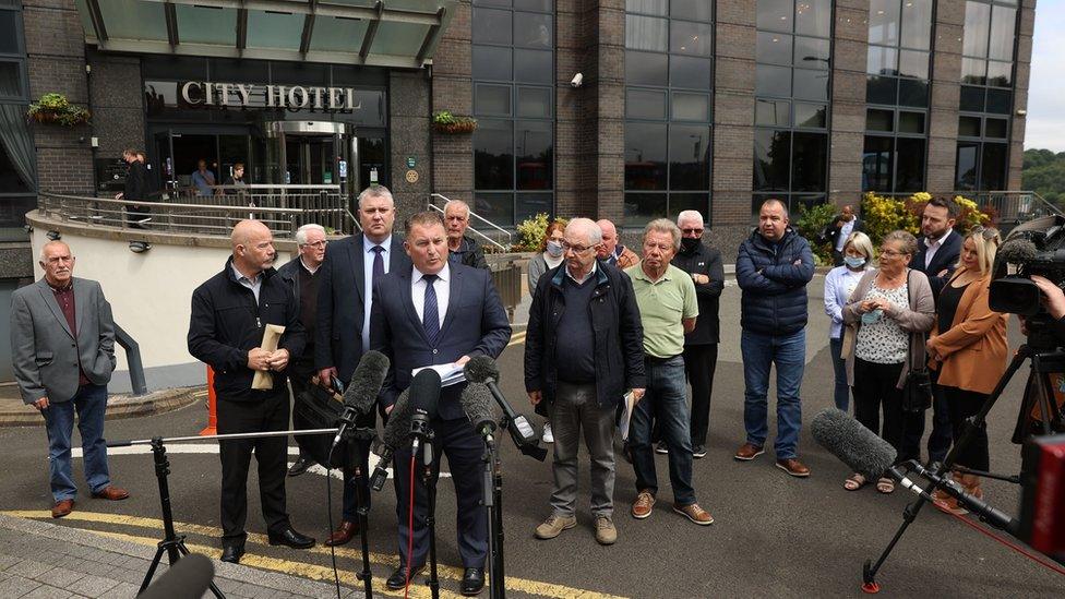 Solicitor Ciaran Shiels with members of victims' families in Londonderry