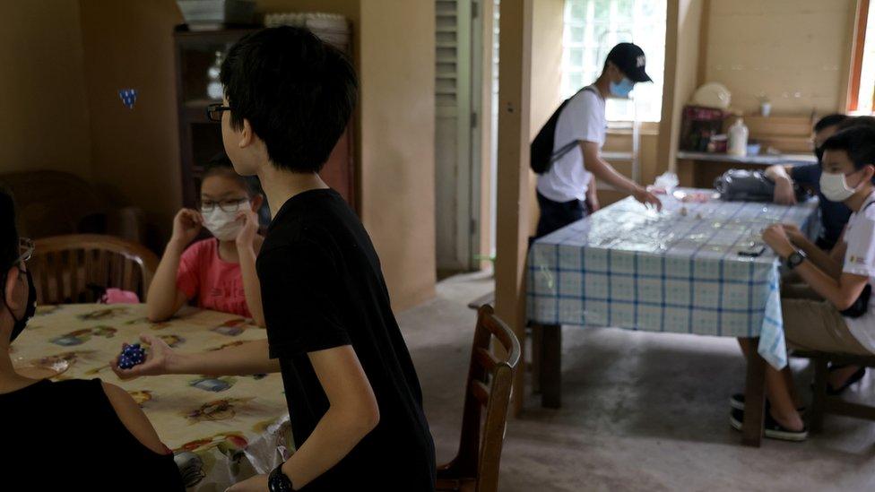 Children playing a traditional game in Singapore, which has one of the world's lowest birth rates