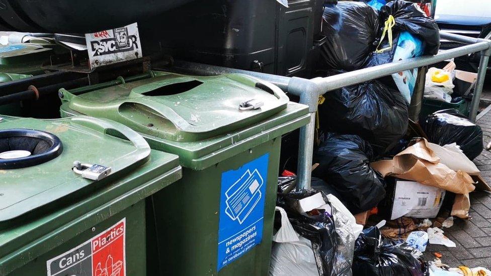 Rubbish loaded up by bins in St Pauls