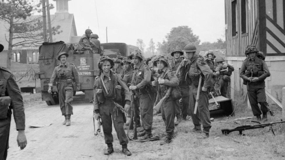 Black and white photo of B Company in combat gear