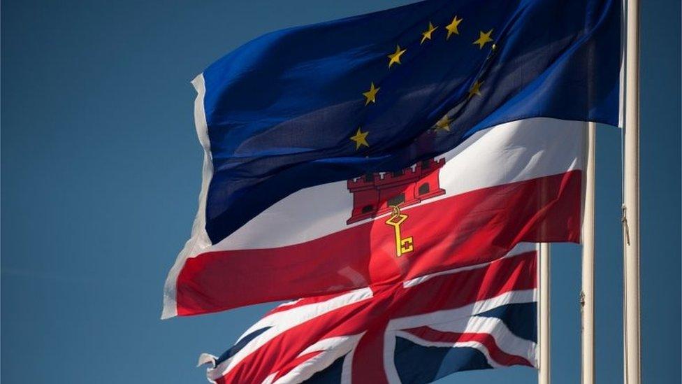 Union Jack flag, the flag of Gibraltar and the EU flag