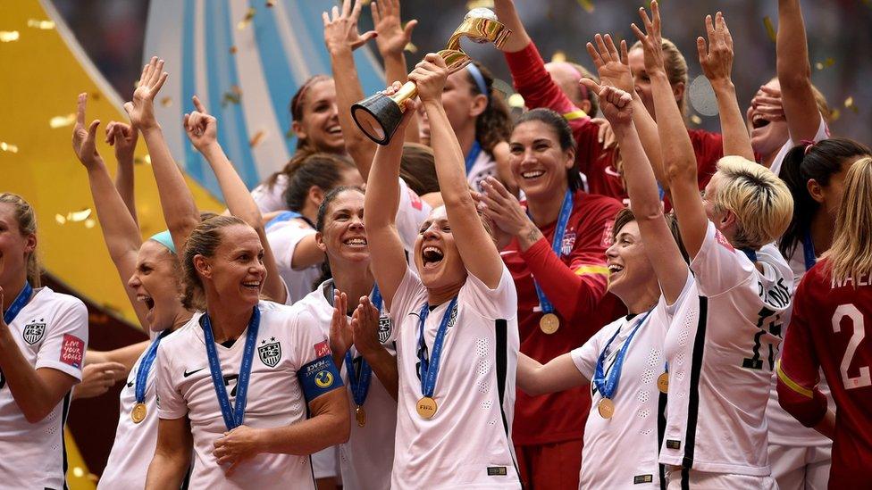 USA players celebrate with the trophy