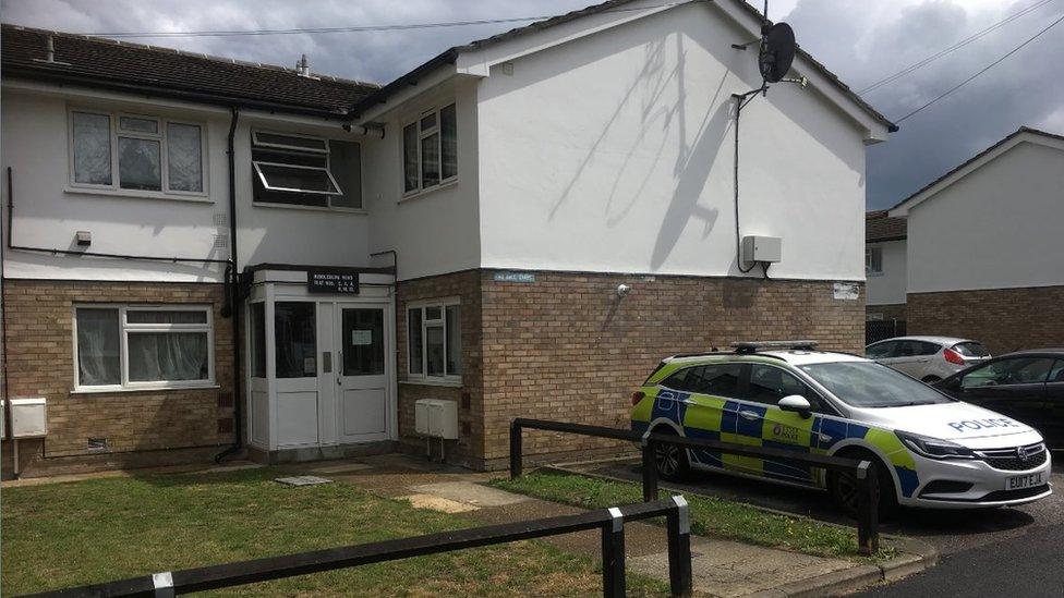 A block of flats with a police car outside on Canvey Island