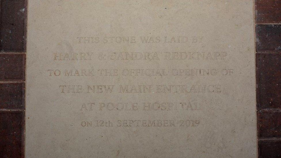 Stone engraved with the following words: This stone was laid by Harry and Sandra Redknapp to mark the official opening of the new main entrance at Poole Hospital on 12th September 2019