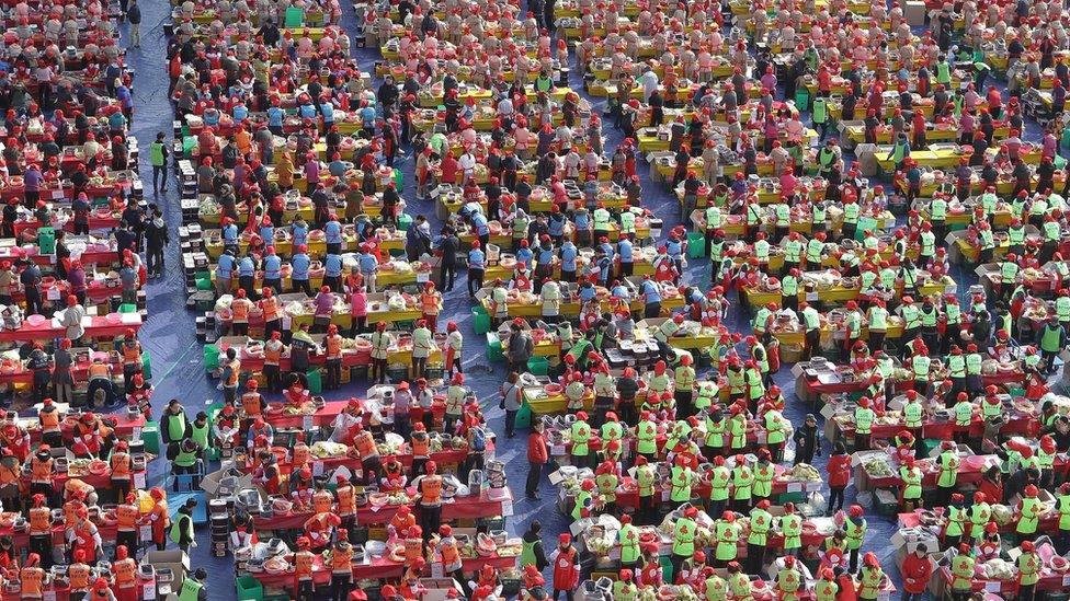 More than two thousand South Koreans make Kimchi to donate to the poor in preparation for the winter, at the City Hall of Seoul in November 2014