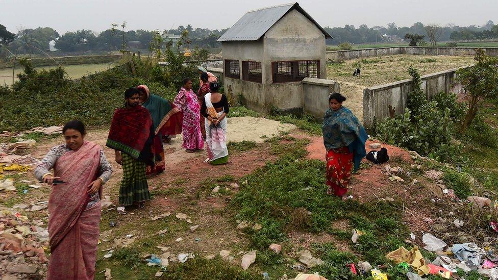 Jhumur Begum, head of a coalition of sex workers, leads a group in paying their respects to Hamida Begum