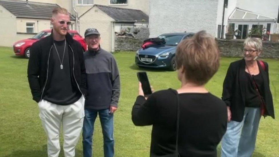 Ben Stokes has his photograph taken with a fan at Cockermouth Cricket Club