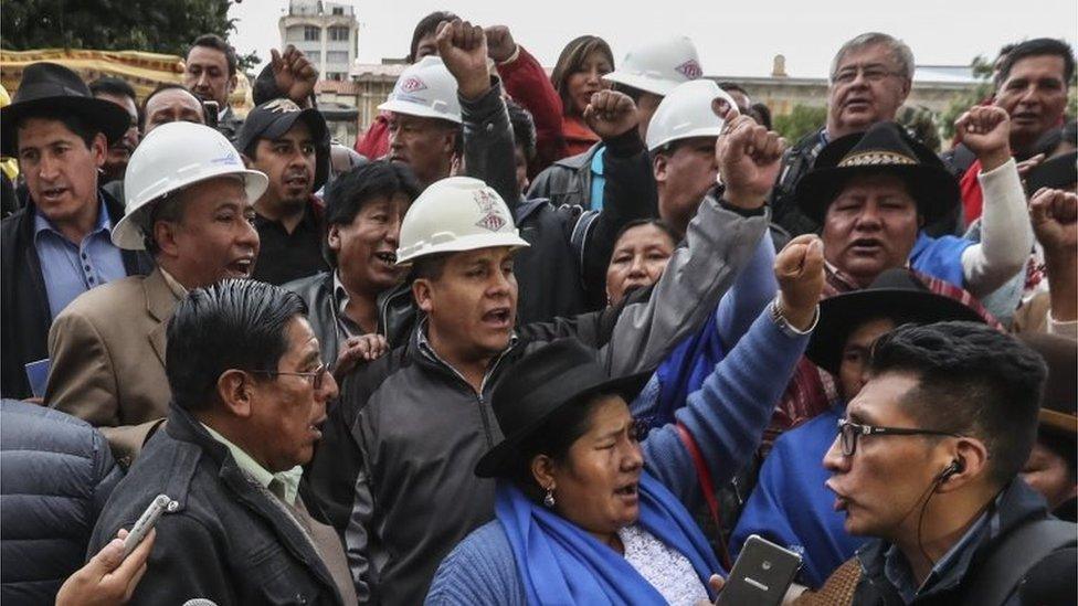 Supporters cheer after the announcement of a judicial decision which allows Bolivian President Evo Morales to seek a fourth term in office, at the Murillo Square in La Paz, Bolivia, 28 November 2017.