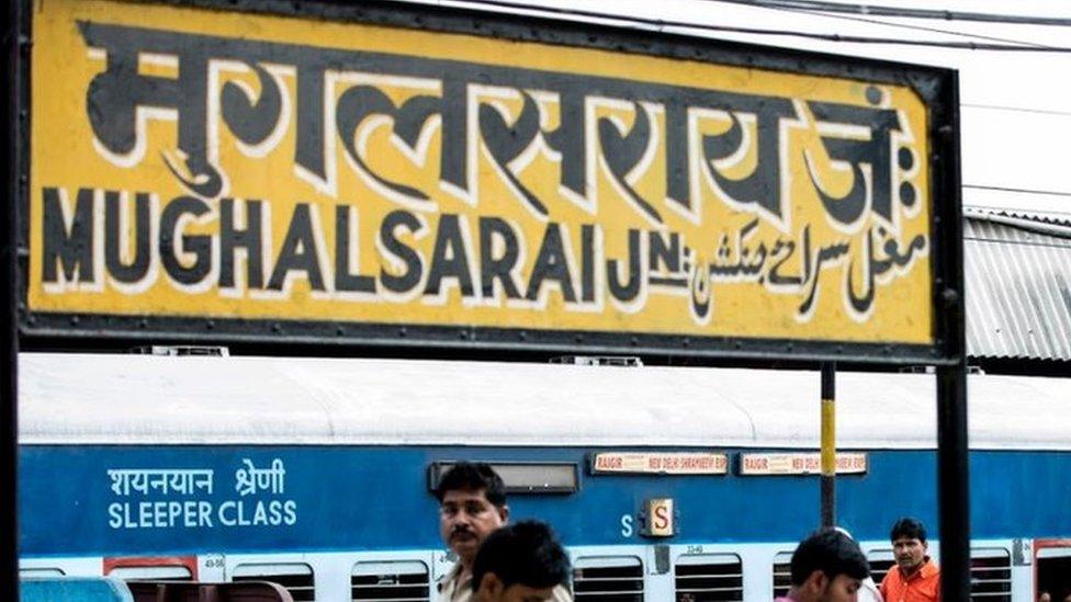 People at the Mughalsarai station platform waiting for their train