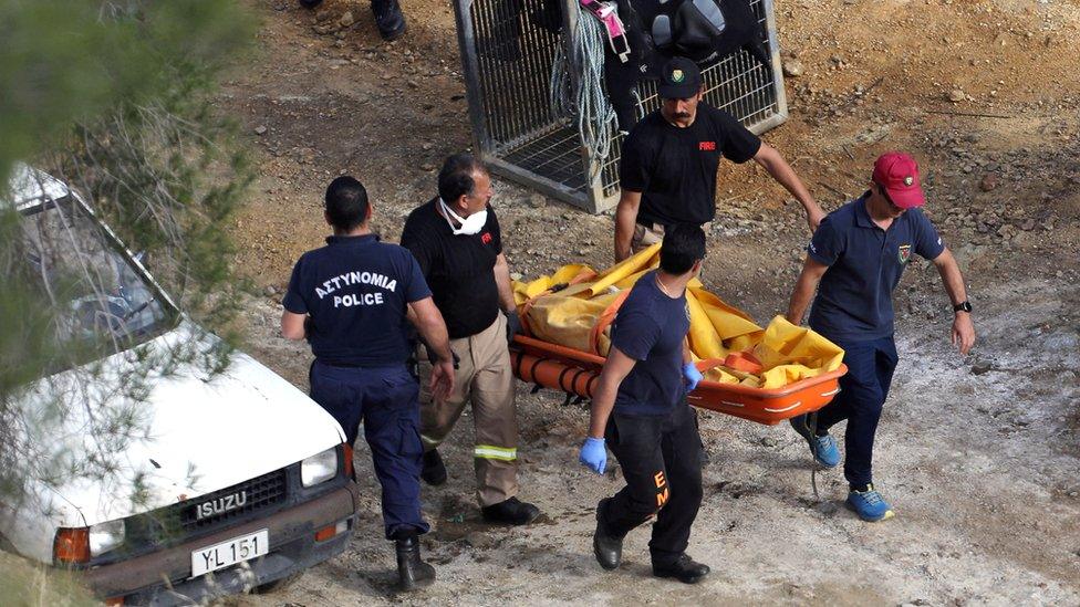 Members of Cyprus Special Disaster Response Unit carry a body retrieved near the so-called Red Lake, Cyprus, 5 May 2019