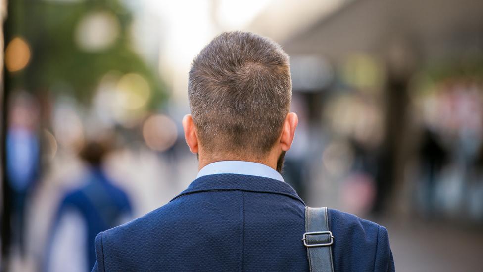 Man seen from behind