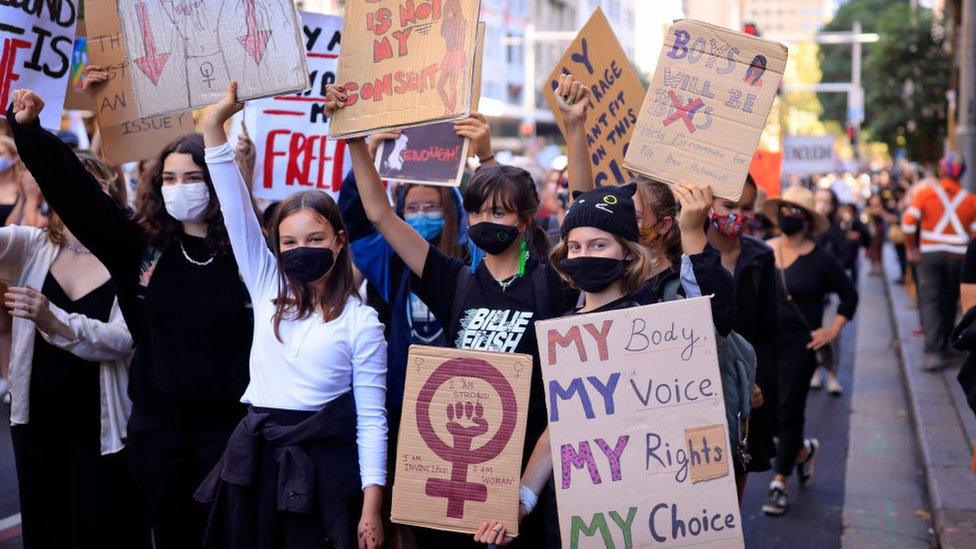 Young girls are seen marching in a protest against violence against women in Sydney