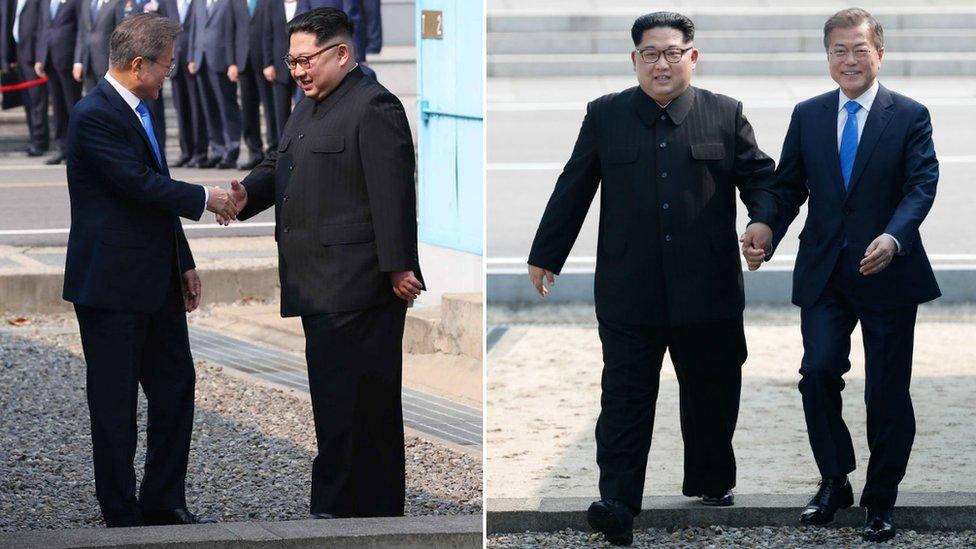 North Korean leader Kim Jong Un (L) and South Korean President Moon Jae-in (R) cross back the military demarcation line to the south side after Moon crossing the border to north upon meeting for the Inter-Korean Summit April 27, 2018 in Panmunjom, South Korea.