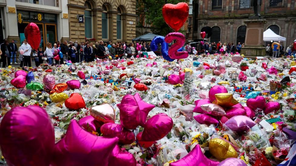 Flowers and balloons at St Anne's Sq