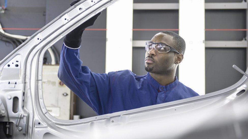 Man working in car production