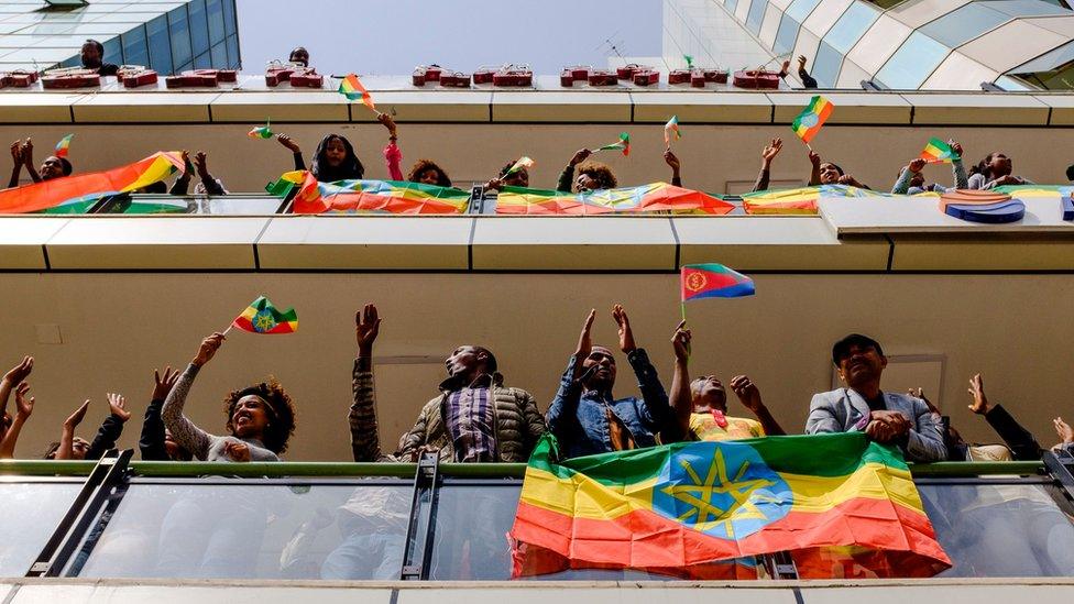 People gather on balconies holding Ethiopian flags - 14 July