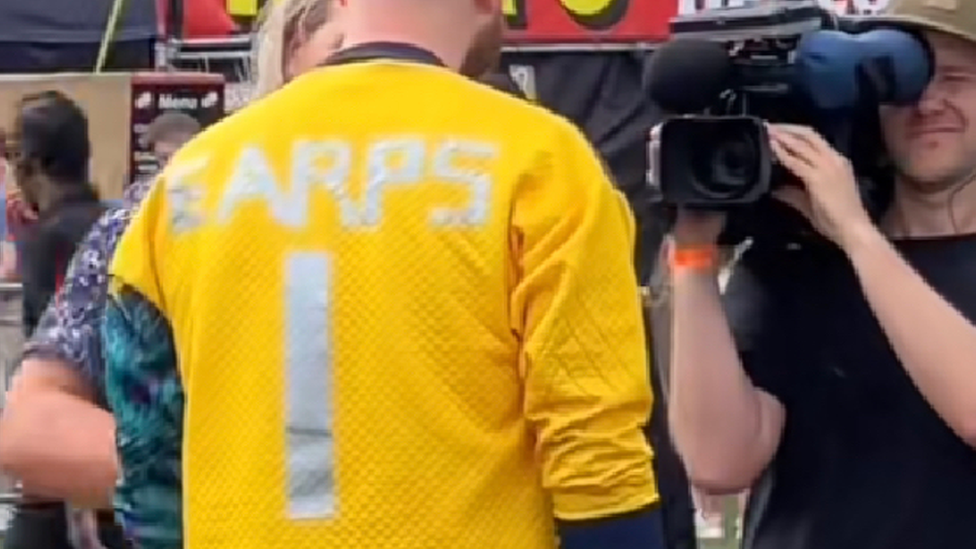 Yellow shirts with Ears letters taped on.