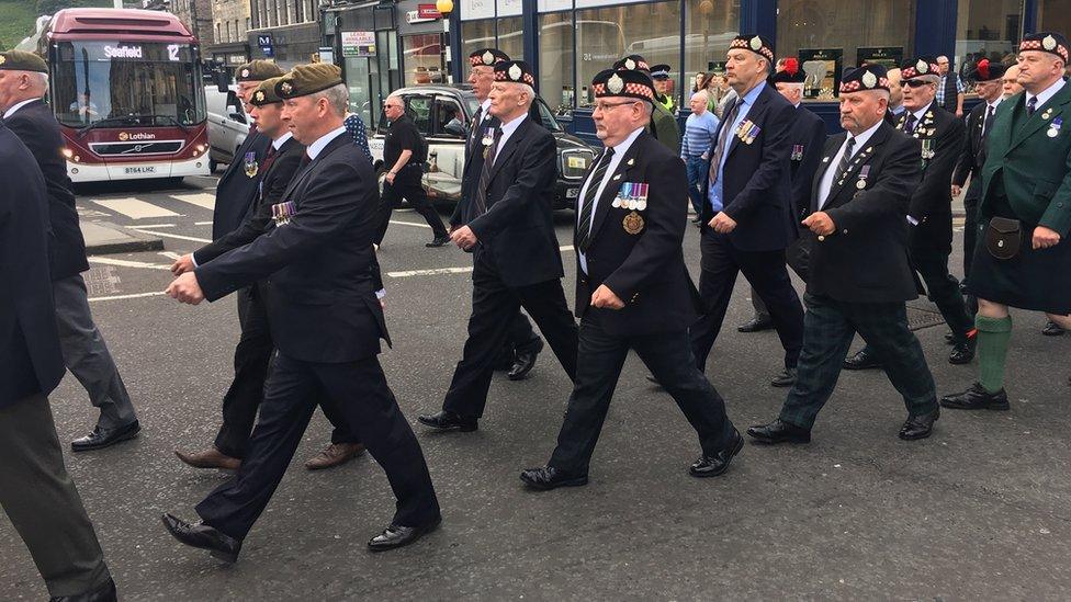 servicemen and women march through central Edinburgh for the annual Armed Forces Day