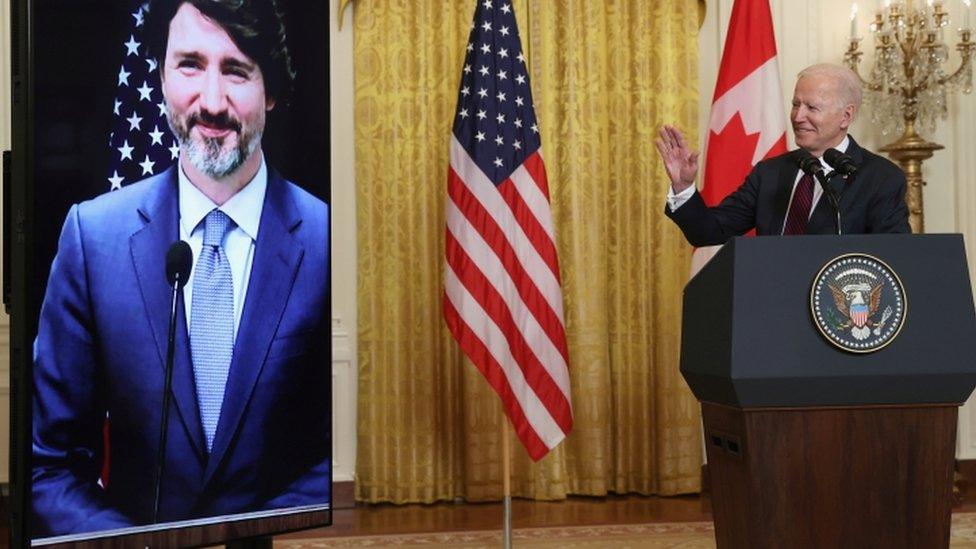 Justin Trudeau on screen and Joe Biden