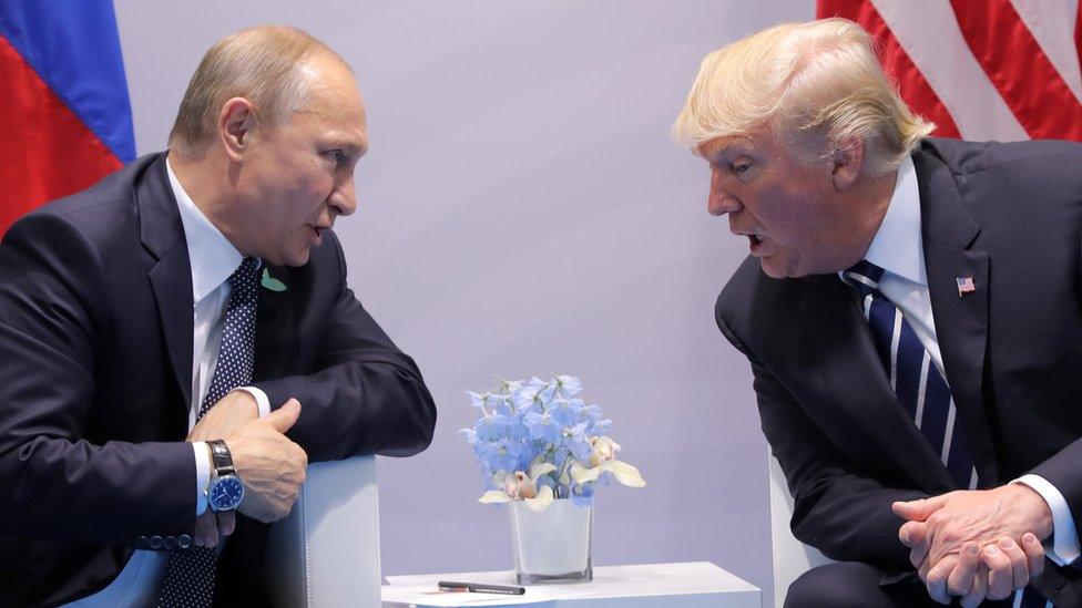 Russian President Vladimir Putin speaks with Donald Trump during their bilateral meeting at the G20 summit in Hamburg, July 7, 2017