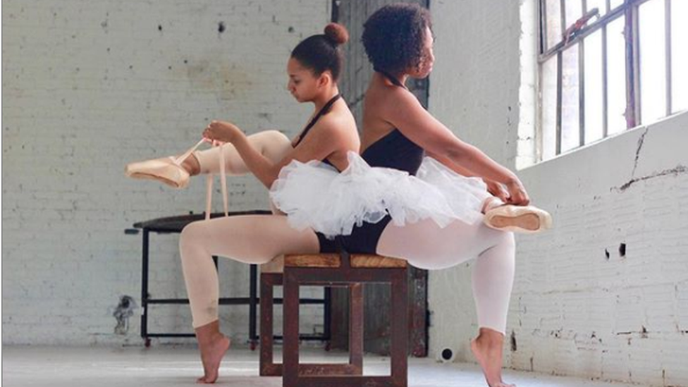 Photo of two ballet dancers