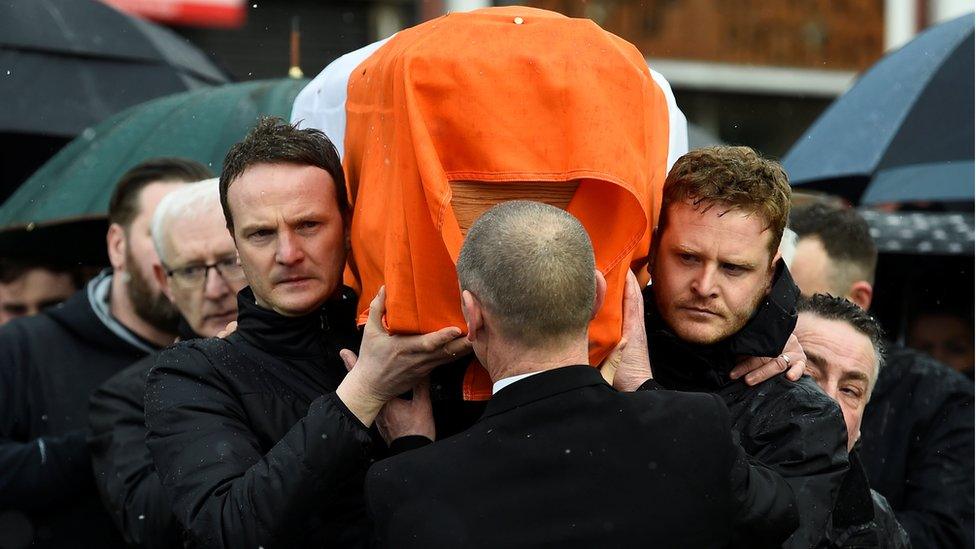 Martin McGuinness' sons, Fiachra and Emmet, carry his coffin through the streets of the Bogside in Derry