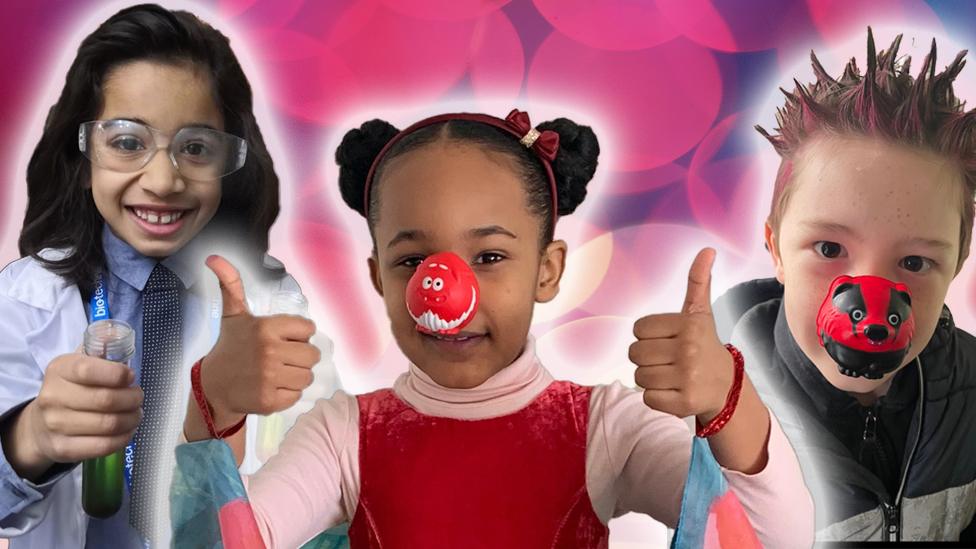 Three kids - one dressed as a scientist, one girl wearing a red nose and a boy with spiky hair wearing a red nose