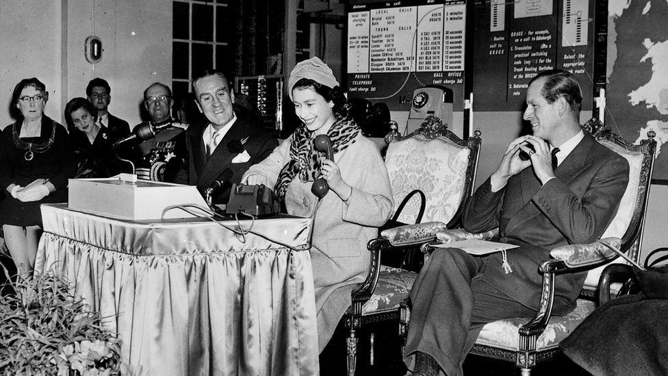 Photo dated 5/12/1958 of Queen Elizabeth II placing the first long-distance phone call made without the help of an operator at the central telephone exchange in Bristol.