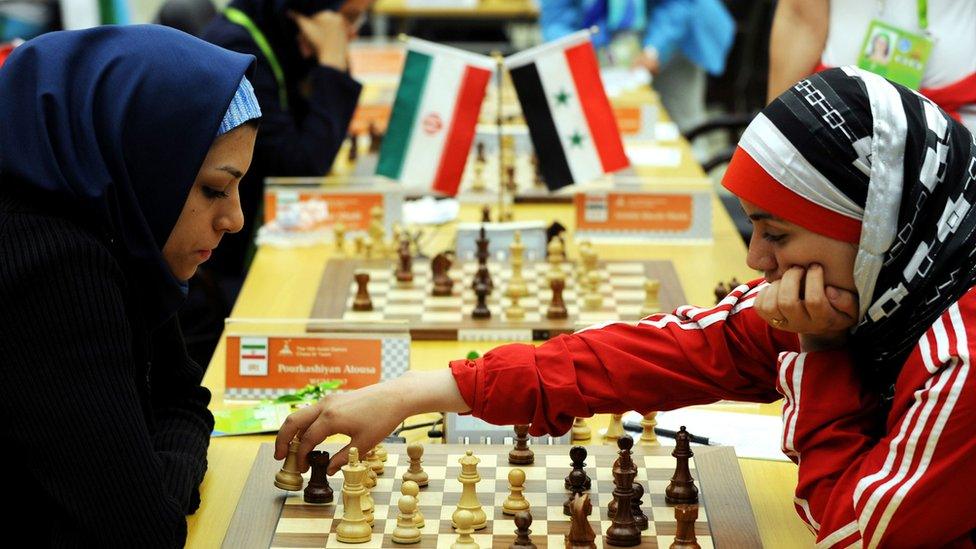 Fatemah al-Jeldah (R) of Syria makes a move against Atous Pourkashiyan of Iran, China 2010