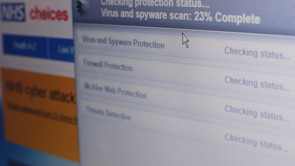 Internet security software performing an anti-virus and anti-spyware scan on a laptop