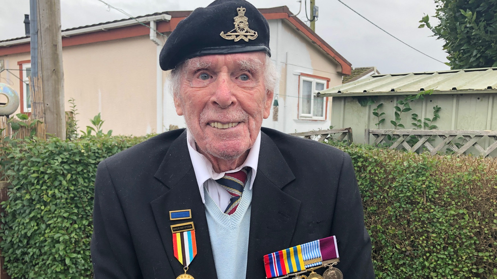 Korean War veteran tommy clough wearing a blazer and his war medals