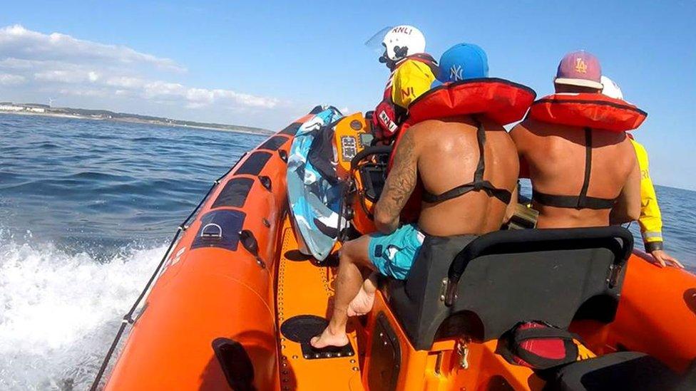 Two rescued men are taken back to shore by RNLI Porthcawl Atlantic 85 inshore boat