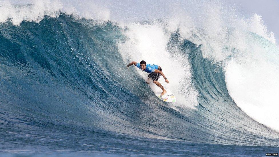 Adriano De Souza of Brazil competes to win the World Surfing League World Title