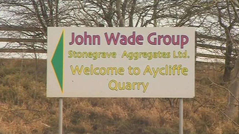 A sign for the John Wade Group site